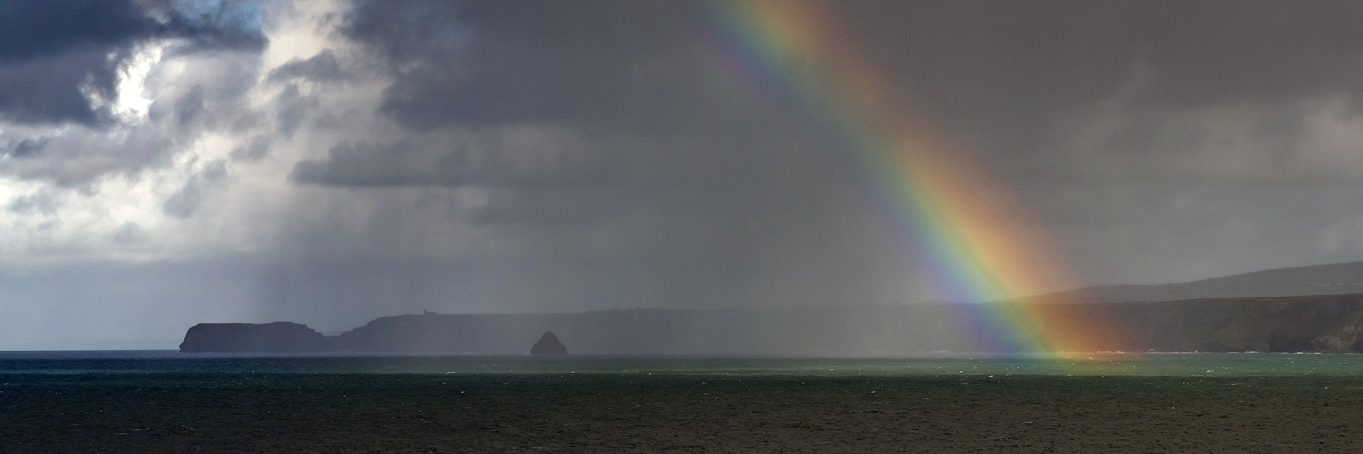 Rainbow with Tintagel headland, Port Isaac, cornwall